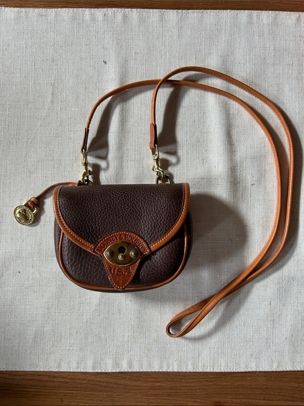 Dooney & Bourke Dark Brown Pebbled Leather Crossbody with Tan Trim